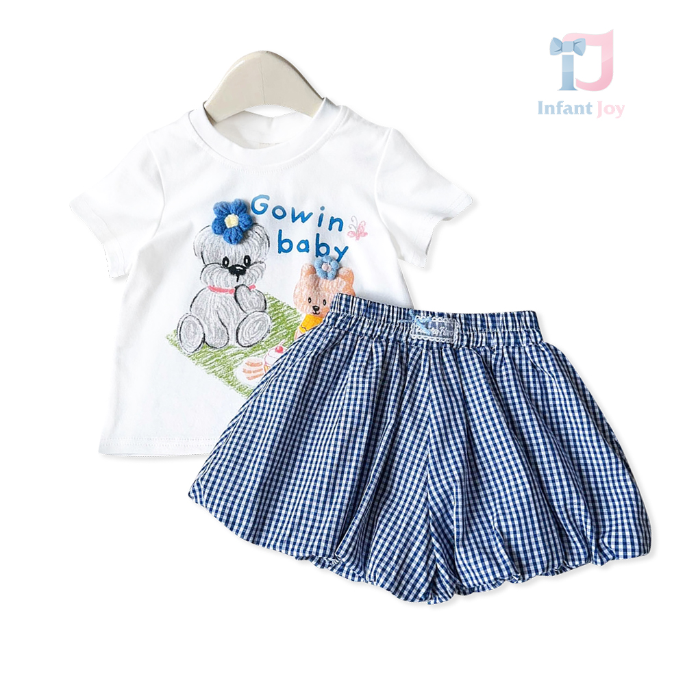 Set de 2 piese din tricou cu elemente imprimate și fustă/pantaloni în carouri Gowin Baby