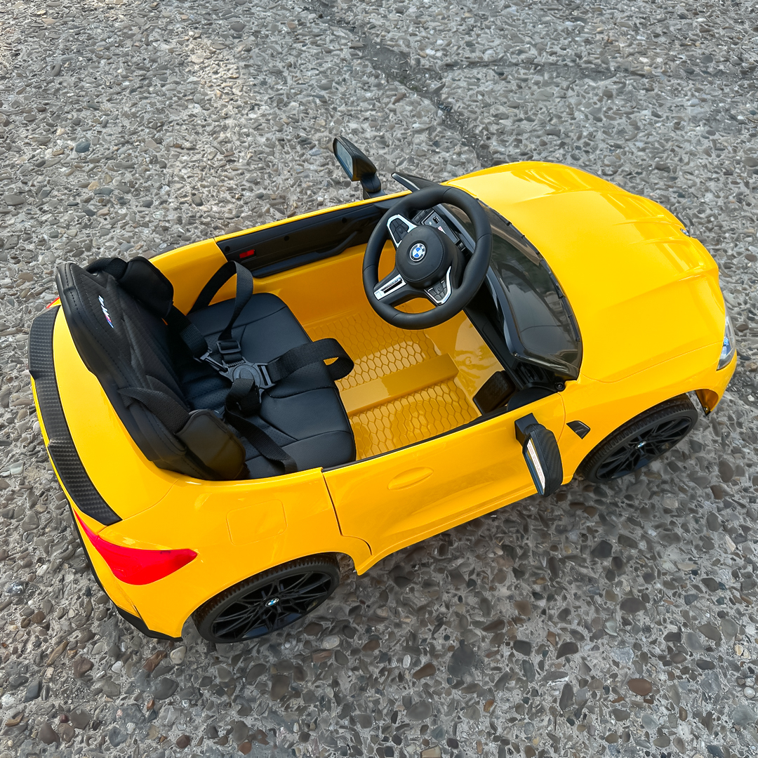 masinuta-electrica-pentru-copii-bmw-m4-90w-putere-baterie-12v-7ah-roti-eva-scaun-tapitat-galben-190765