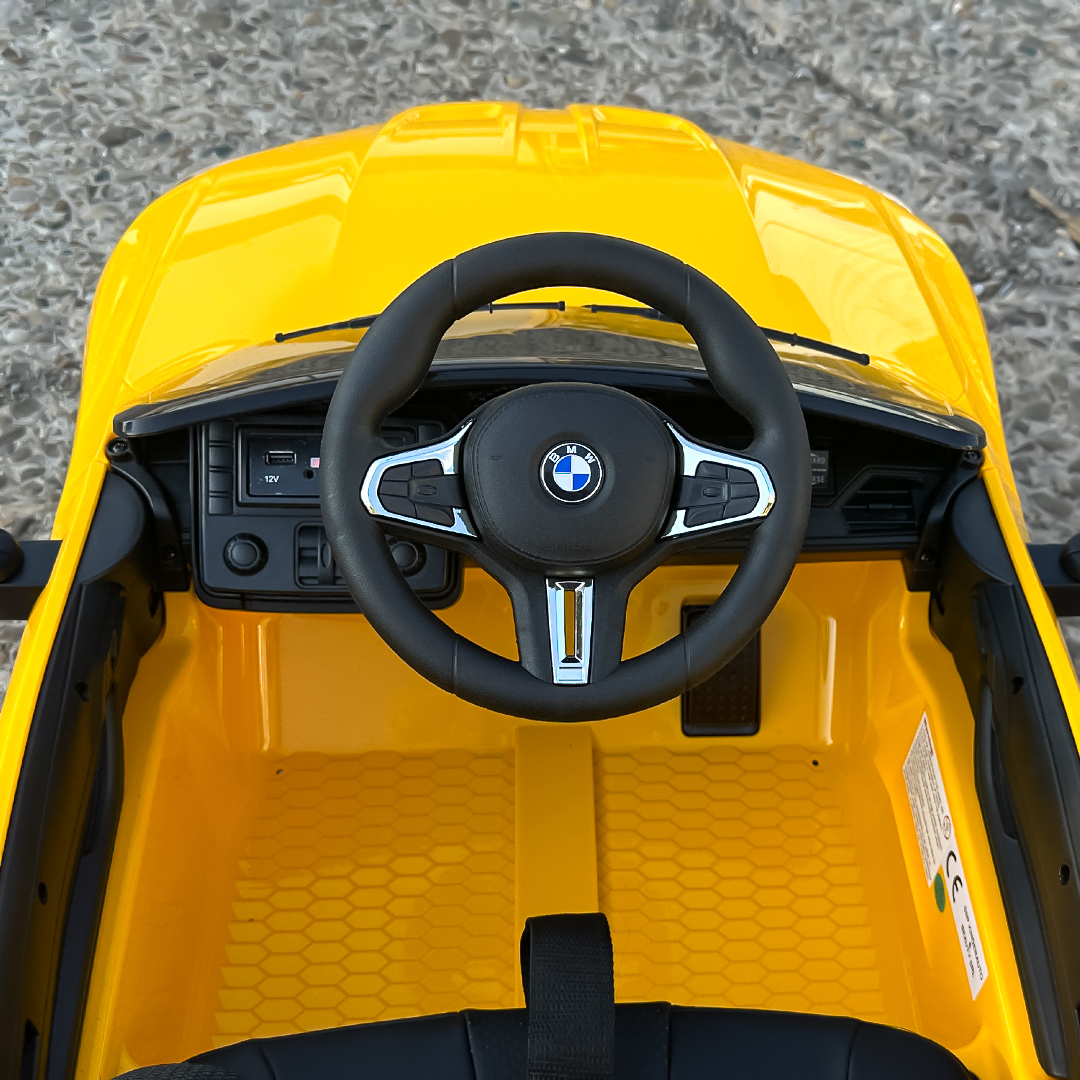 masinuta-electrica-pentru-copii-bmw-m4-90w-putere-baterie-12v-7ah-roti-eva-scaun-tapitat-galben-624028